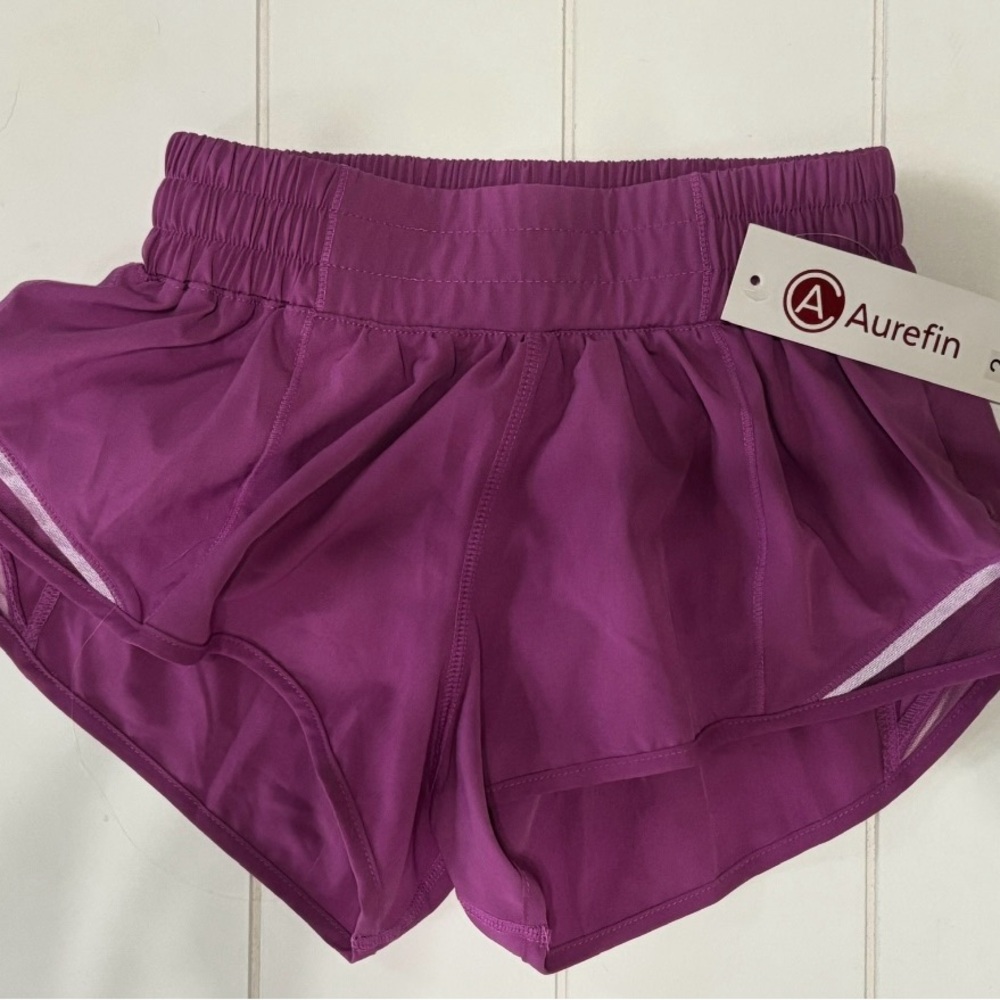 Purple Athletic Shorts with Elastic Waistband and Curved Hem